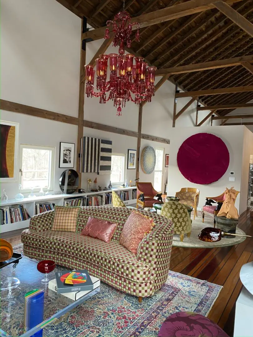 A living space with colorful sofas and chairs